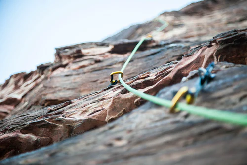 Rock wall with protection and a rope